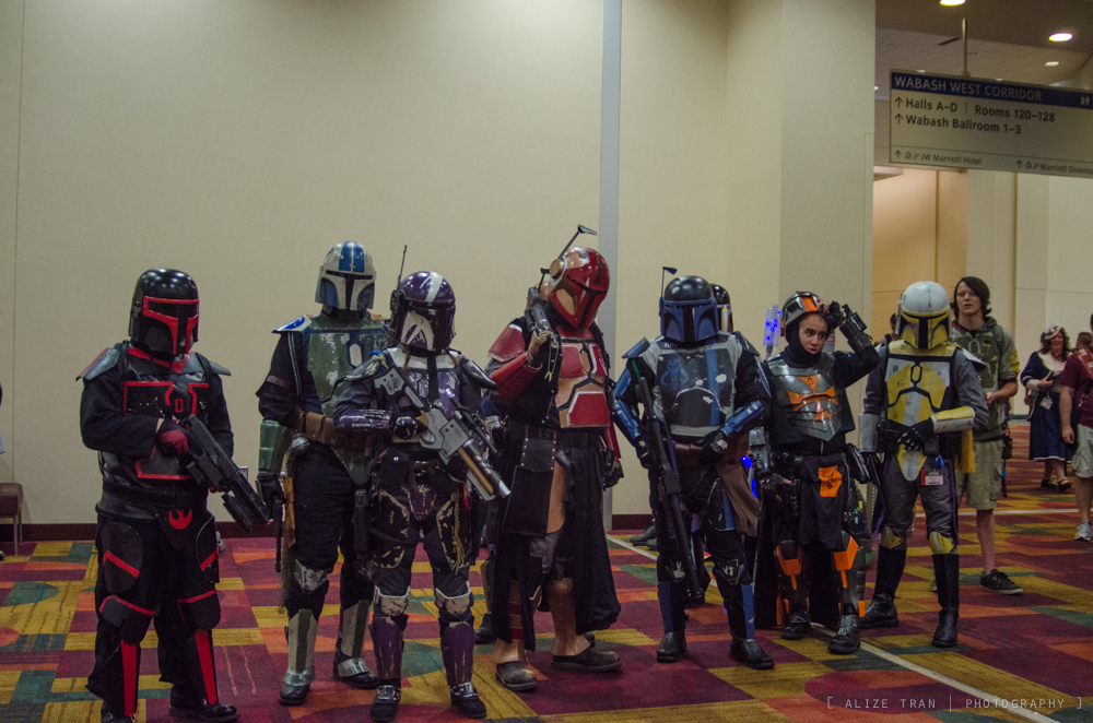 a group of people dressed up in different suits