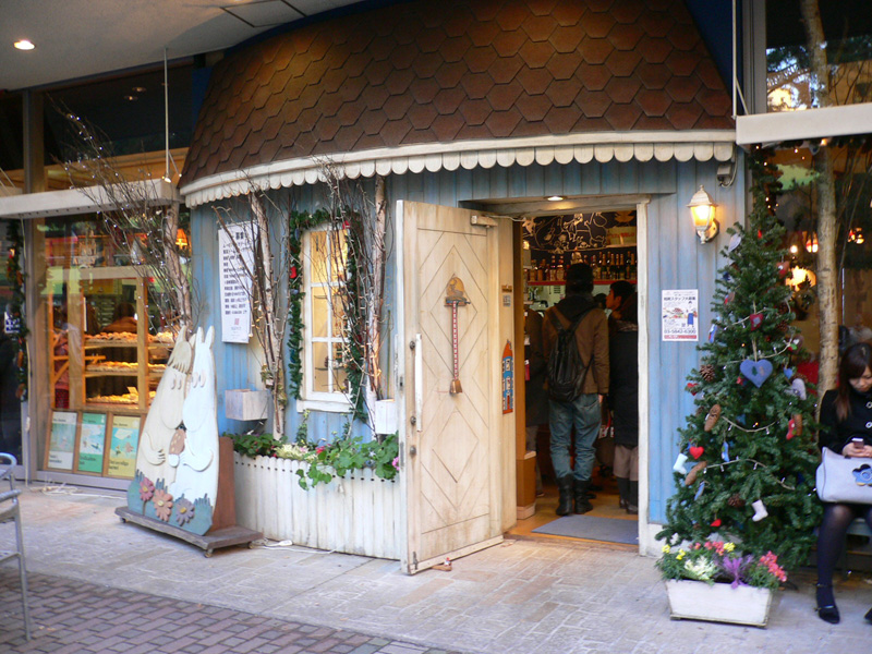 christmas decorations outside of a store selling trees