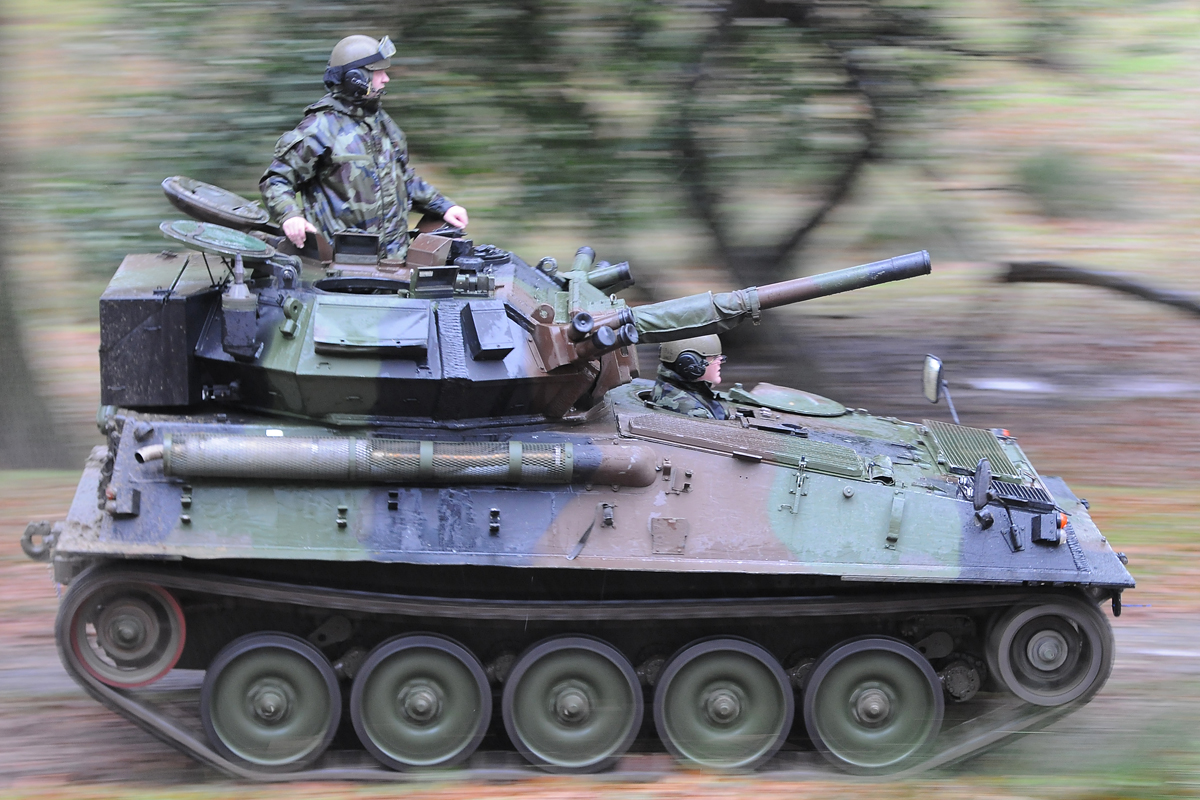 an m1 dley sitting on top of a tank