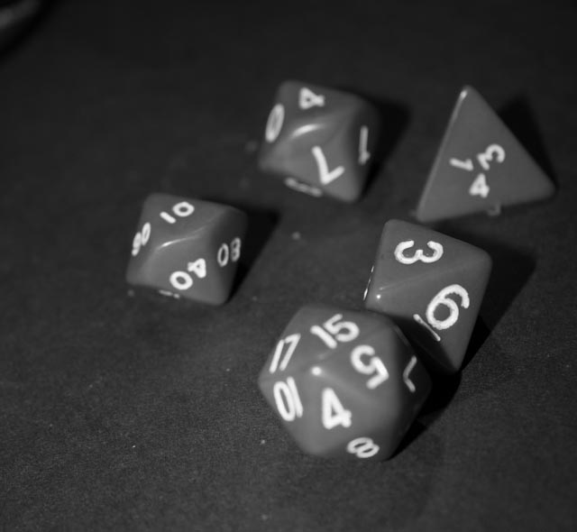 some dices lying out on a table in a dark room