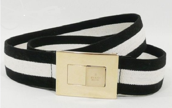 a black and white belt with a metal buckle