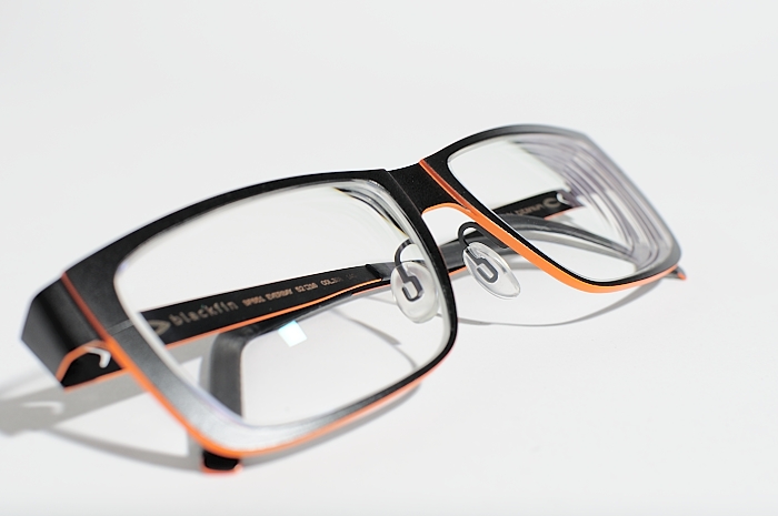 a pair of glasses is pographed on a white background