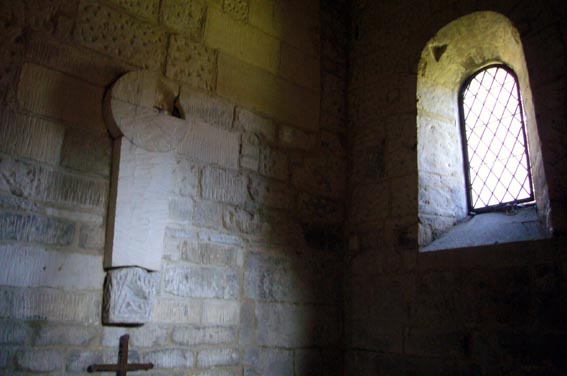 an image of a small room with windows and a cross