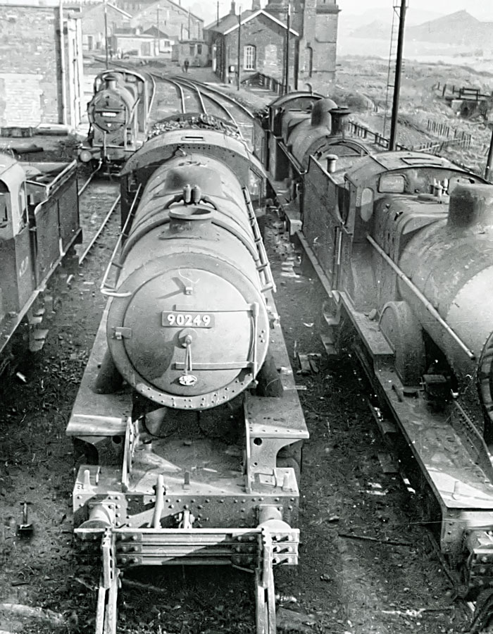 a train yard with trains and railroad cars