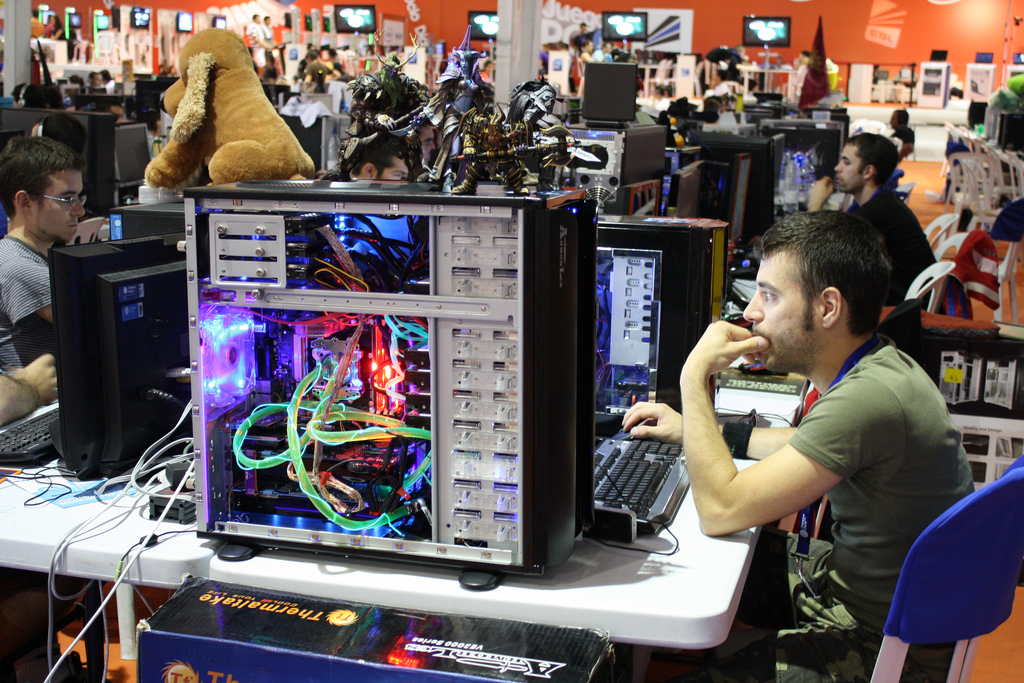 two men working on a small computer in a store