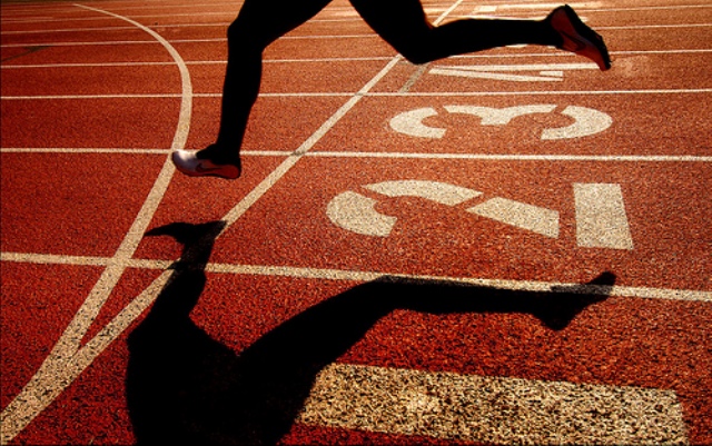 a runner on the starting line of a running track