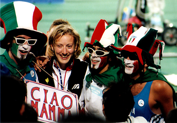 a group of people with faces painted like they are smiling