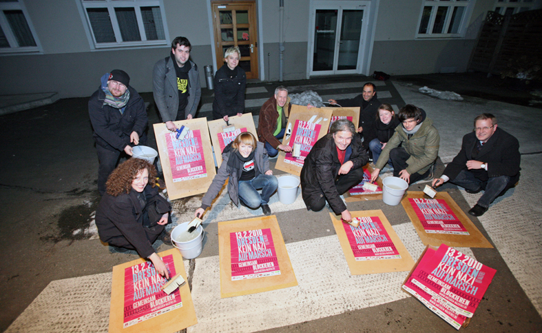 a group of people kneeling around eating boxes