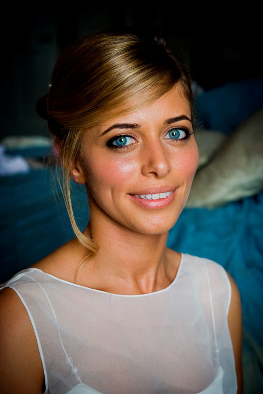 a beautiful blond lady with blue eyes looking off to the side