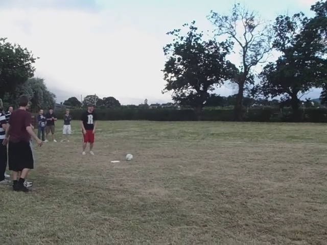 a group of young people playing ball on a field