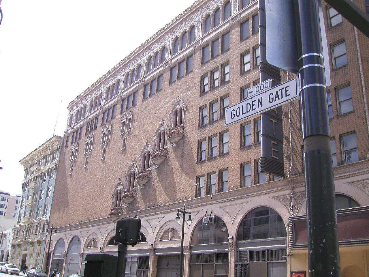 a large building with a few windows and arches around it