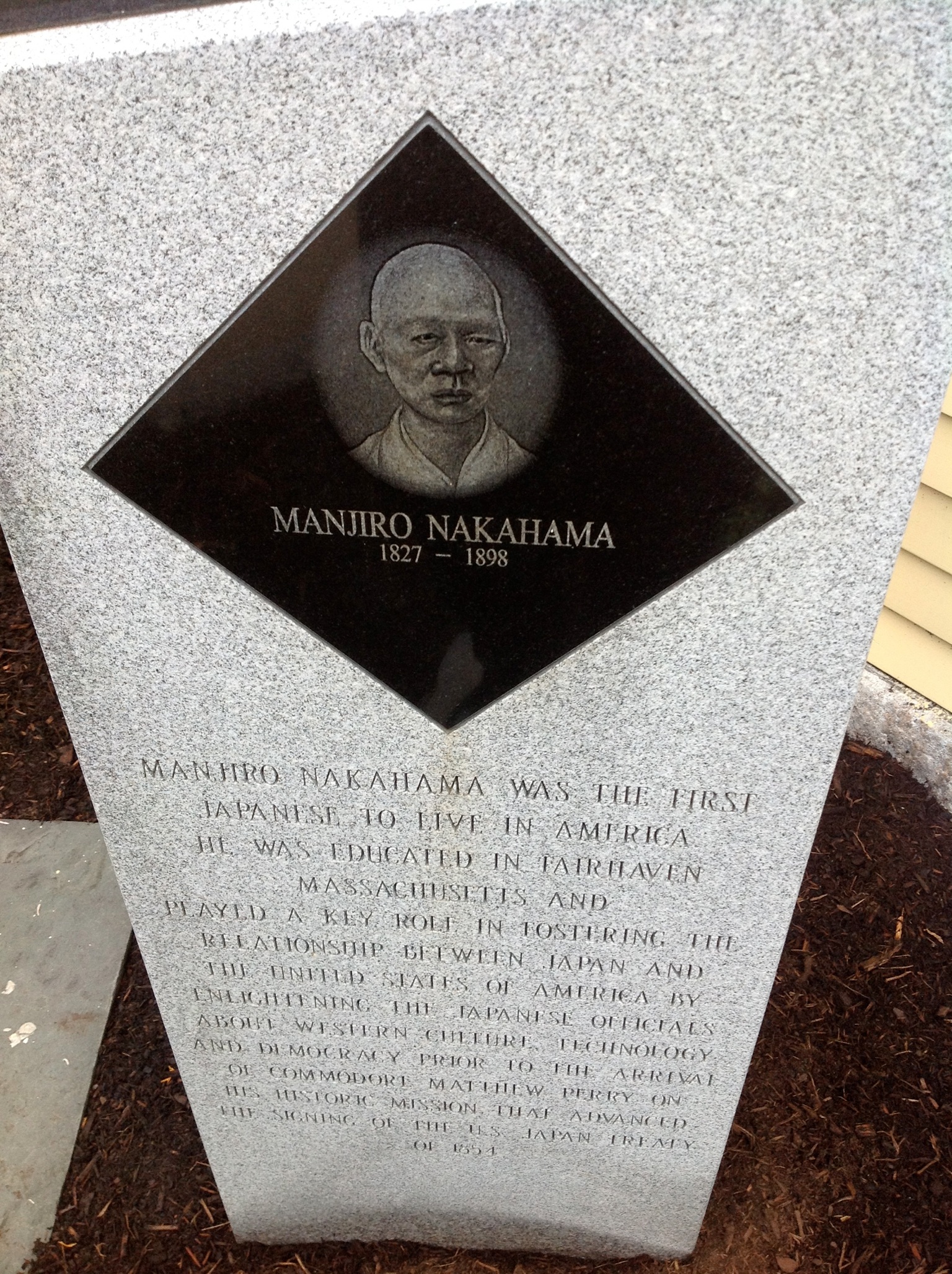 a memorial with a picture of an older man