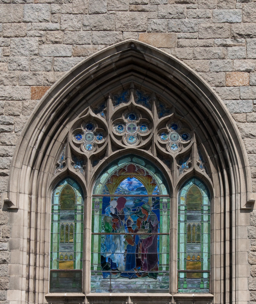 a picture of a beautiful church window with the stained glass and doors