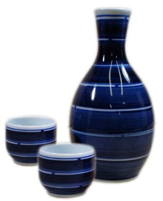 three pieces of blue glass with a striped design