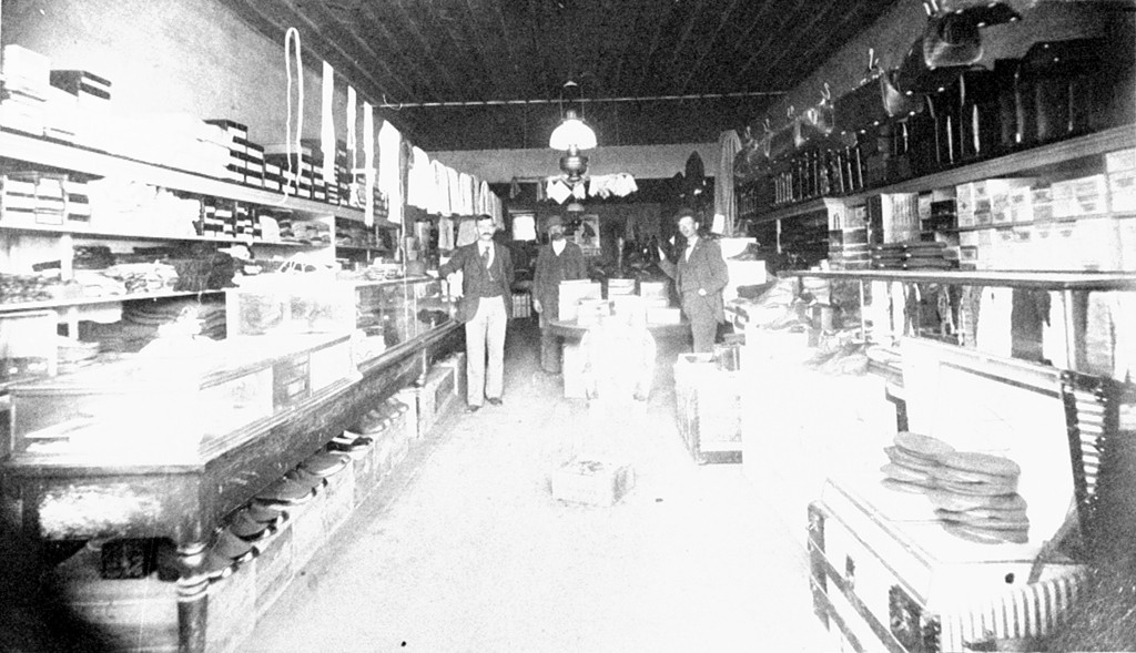 black and white po of people in an old store