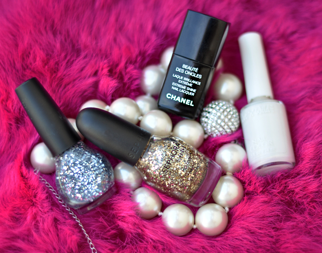 five different types of nail polish and pearls