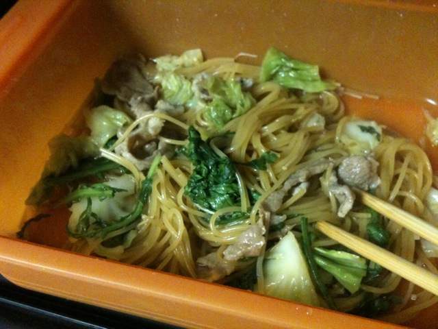 a bowl filled with noodles and meat and vegetables