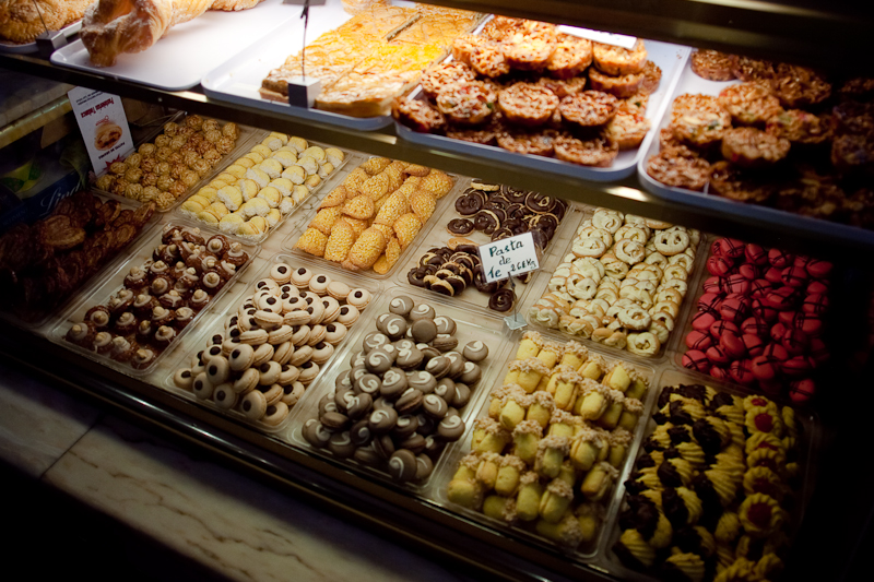 a display of different types of cookies in a case