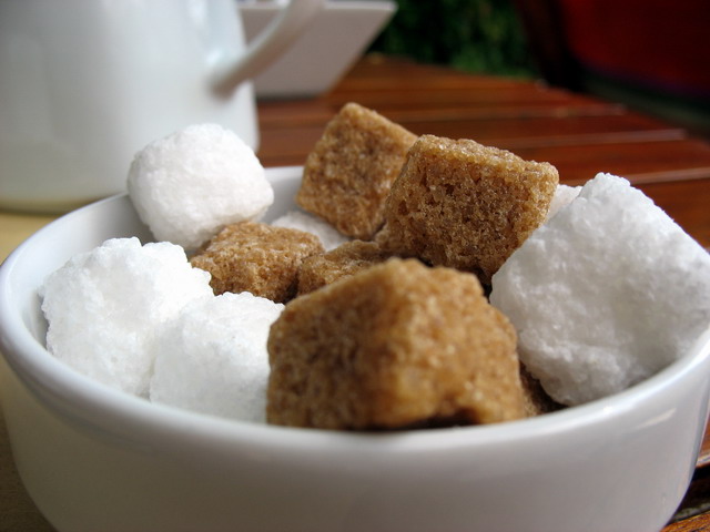 a white bowl filled with sugar and marshmallows
