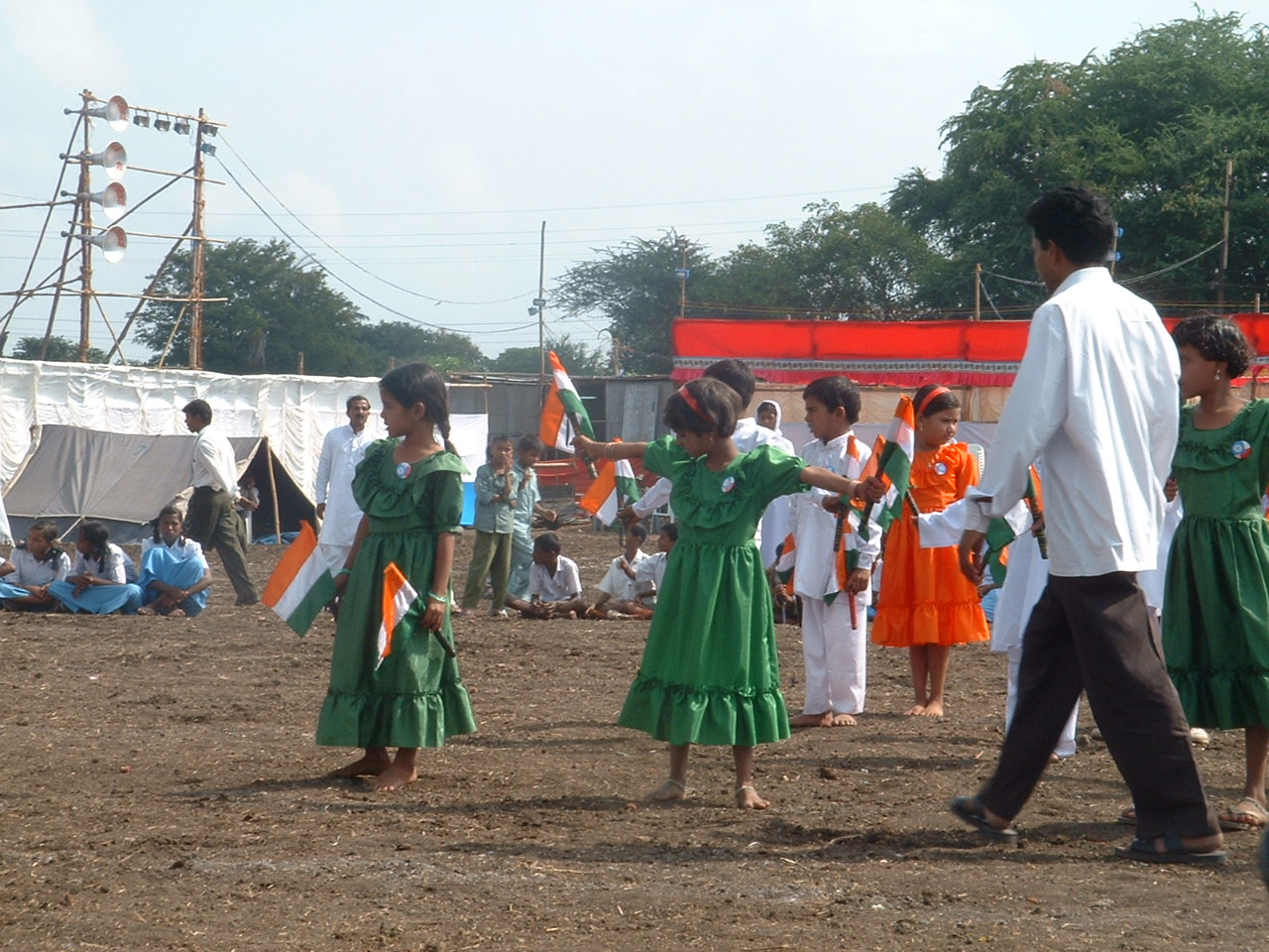 people in traditional costumes dancing at a festival