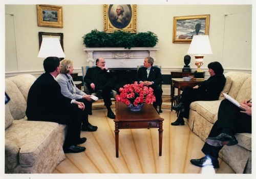 a white house meeting with a group of men and women