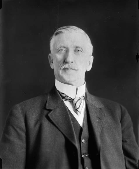 an old po of a man in a suit and bow tie