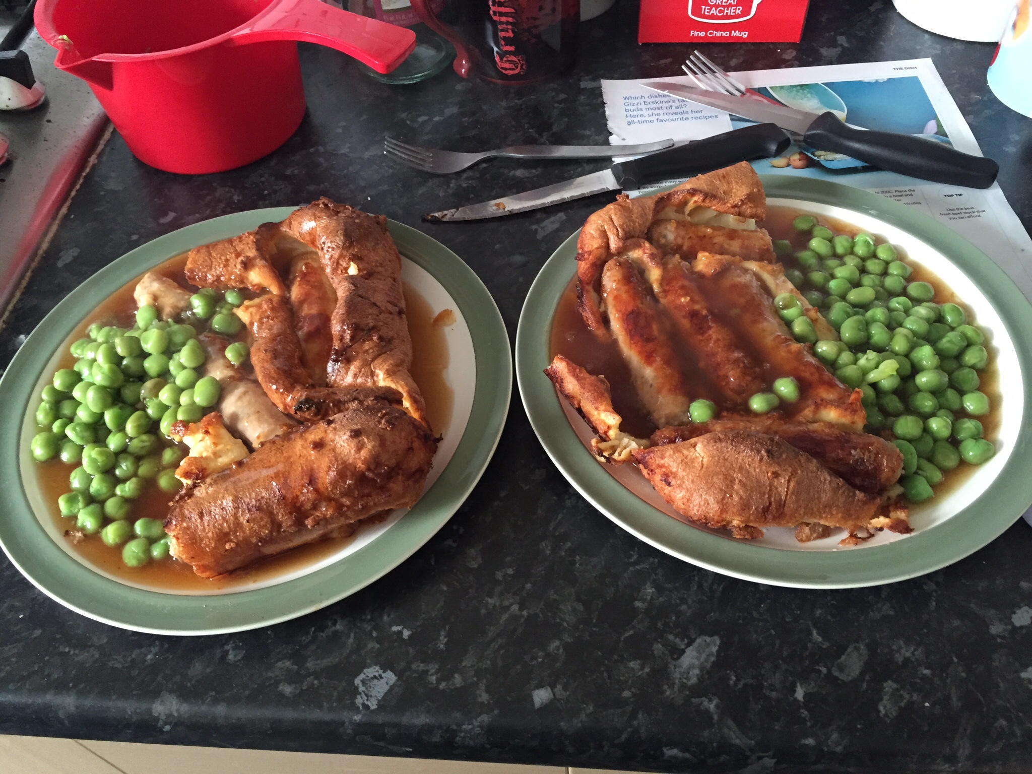 two plates of meat, peas and a tomato sauce