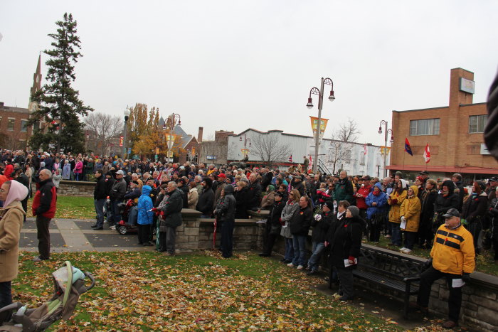 a large crowd of people are gathered in front of a building