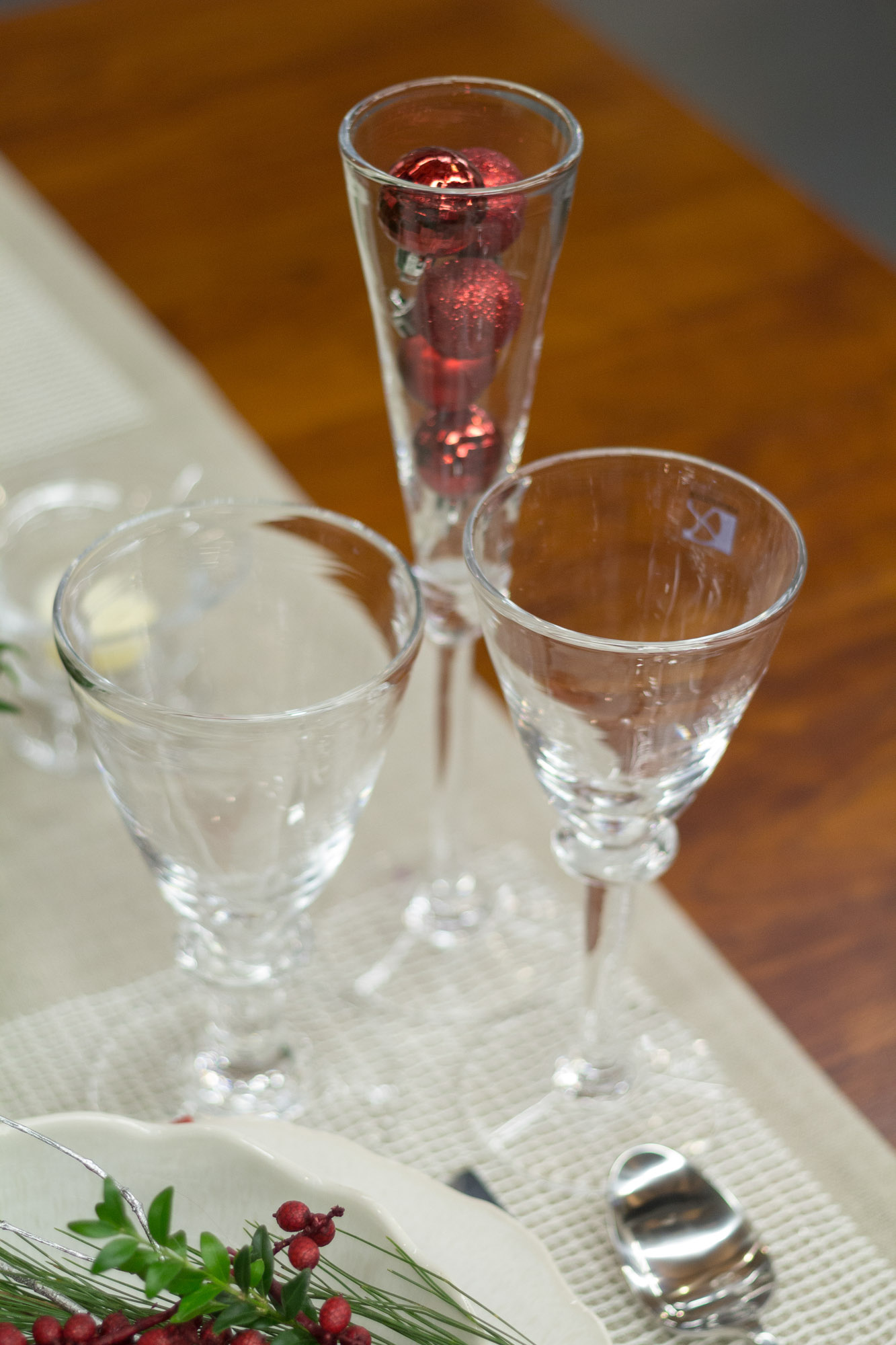 the two glasses on the table have red liquid