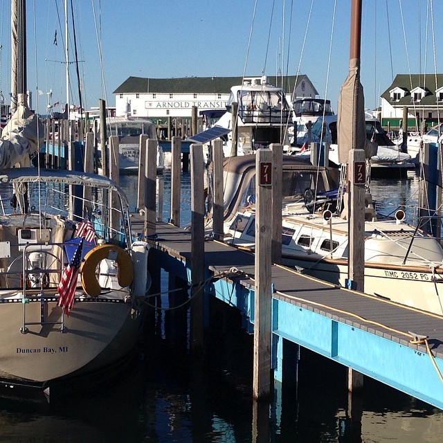 a few boats are docked at the harbor
