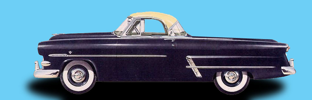 an old black car with yellow accents is against a blue background