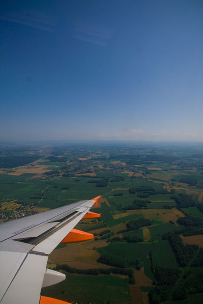 a po taken from an airplane flying over some farmland