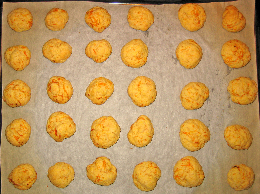 freshly baked cookies lay on parchment paper