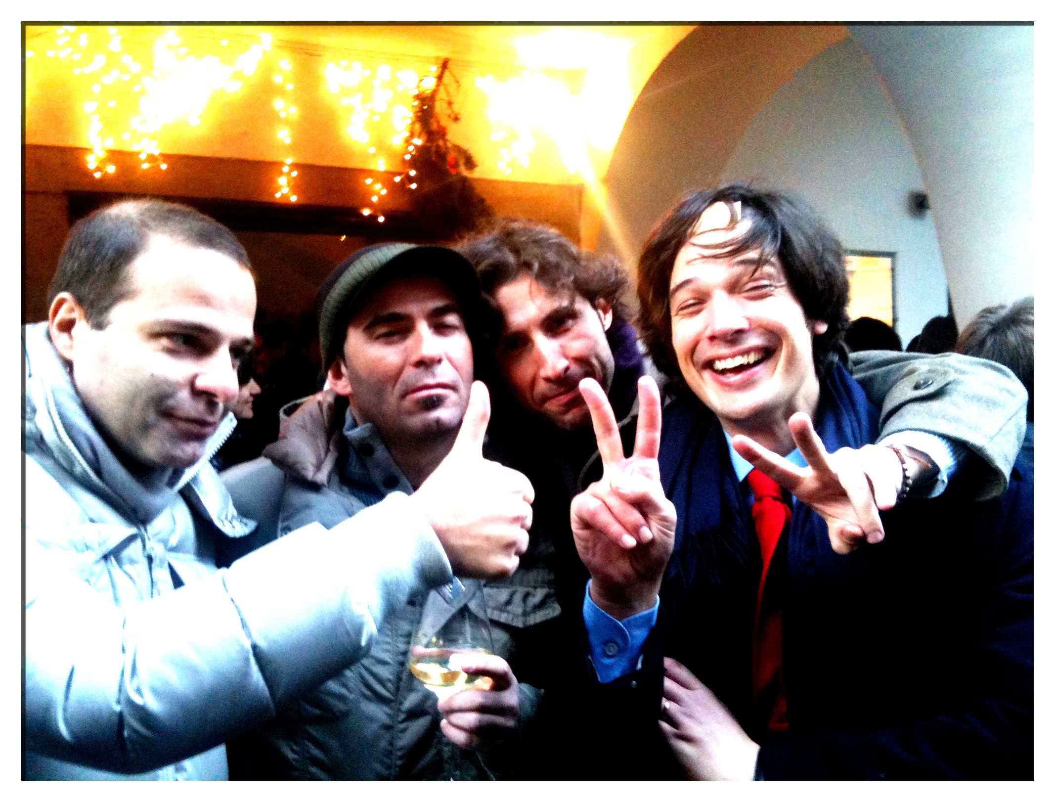 a group of guys posing with a peace sign