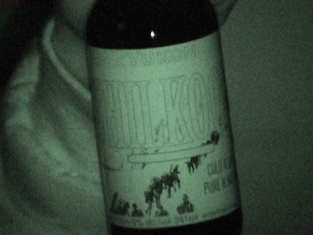 the wine bottle is close up with a blurry background