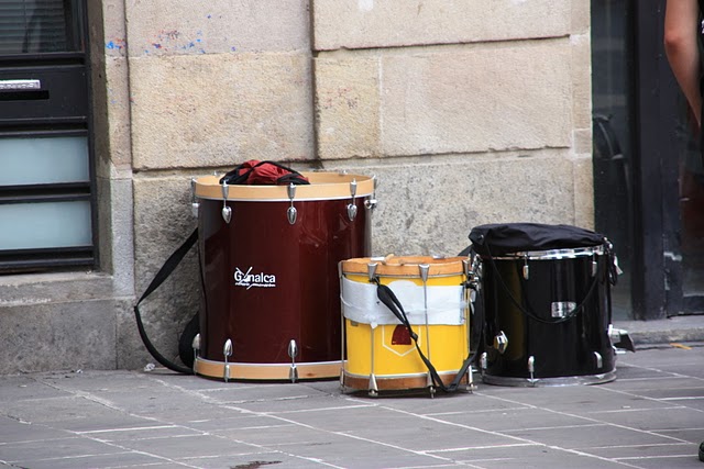 two drums are placed on the side of the street