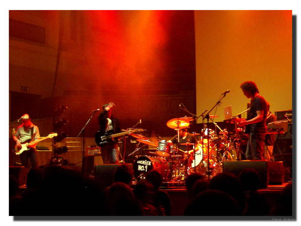 a group of people on stage playing instruments