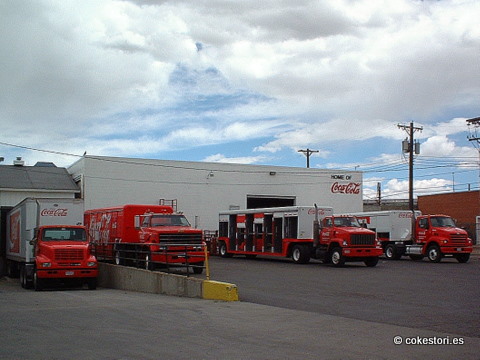 a commercial vehicle parking lot with five trucks