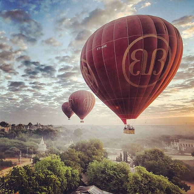 three  air balloons in the sky during sunrise or sunset