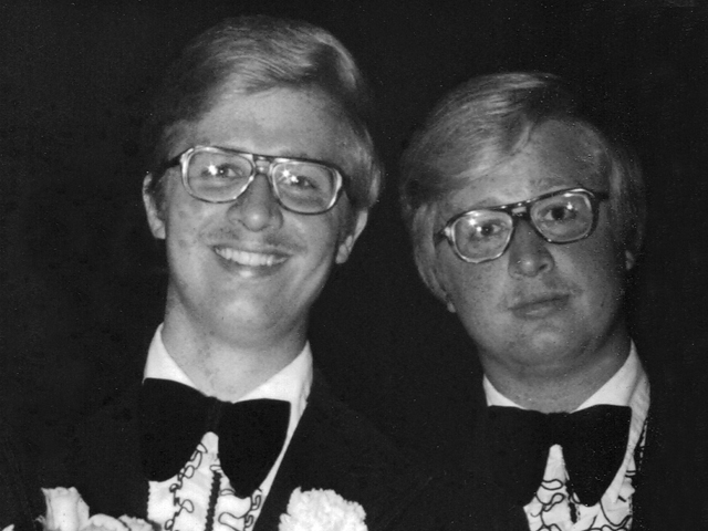 two men wearing bow ties and tuxedos