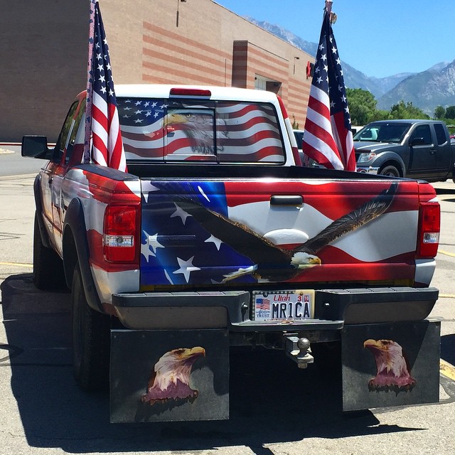 truck with eagle patriotic flags painted on it's rear
