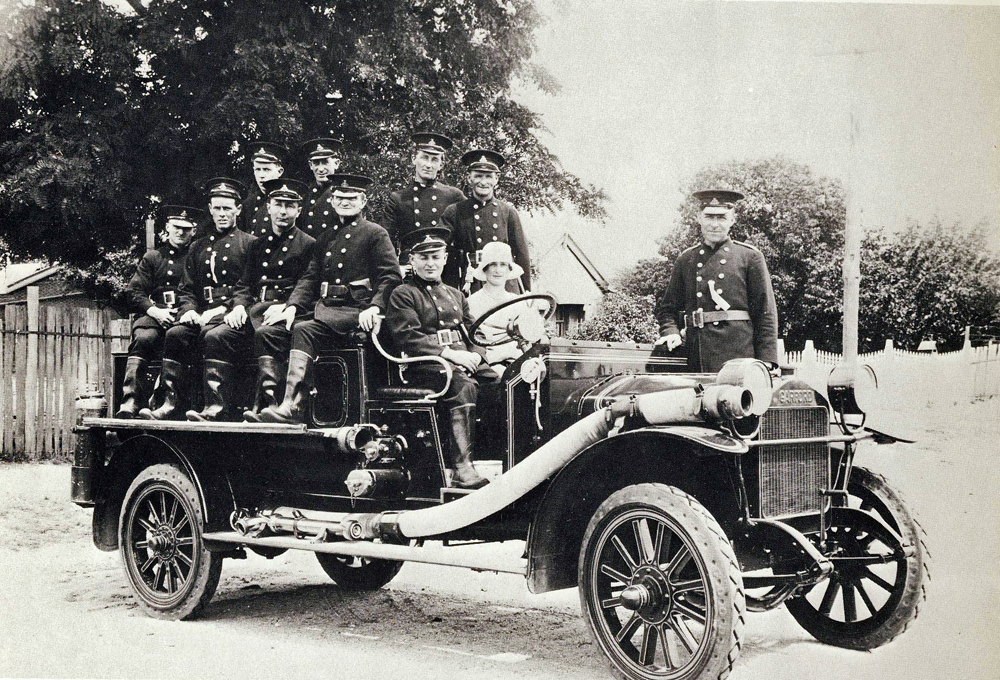 an old car with several soldiers on it