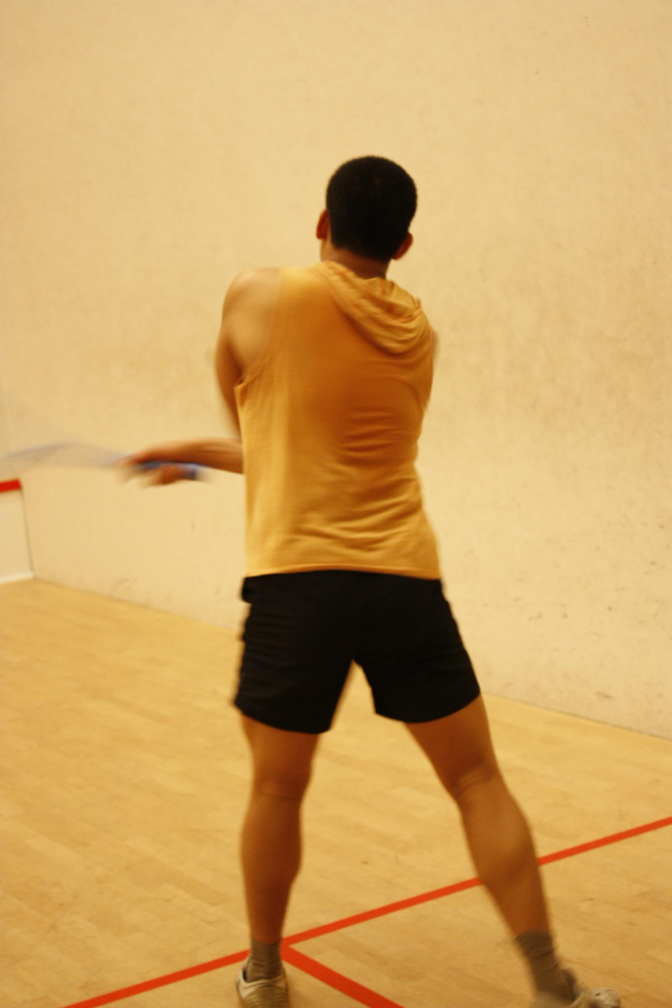 a person on the court with an object in his hand