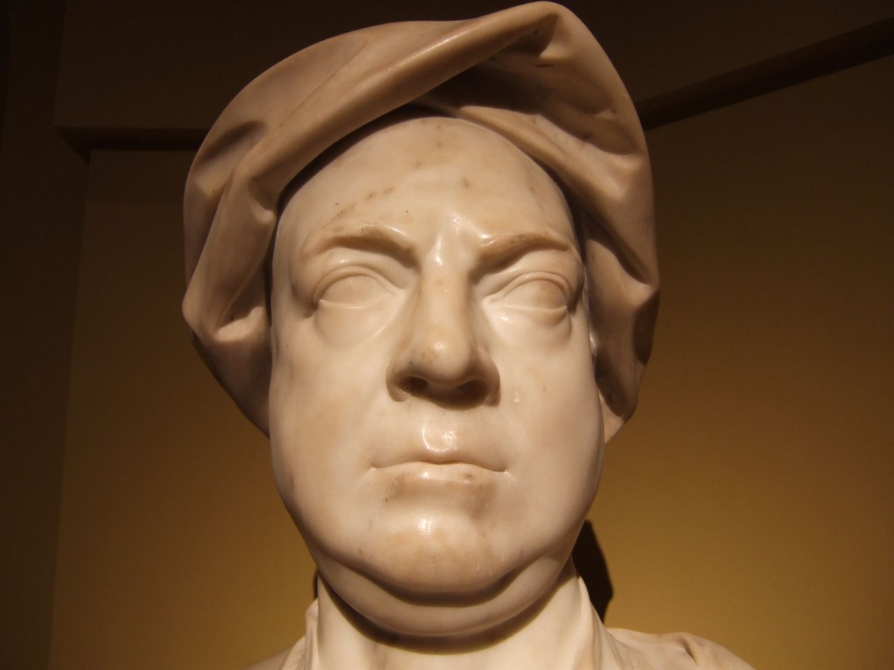 a bust of a man in the dark