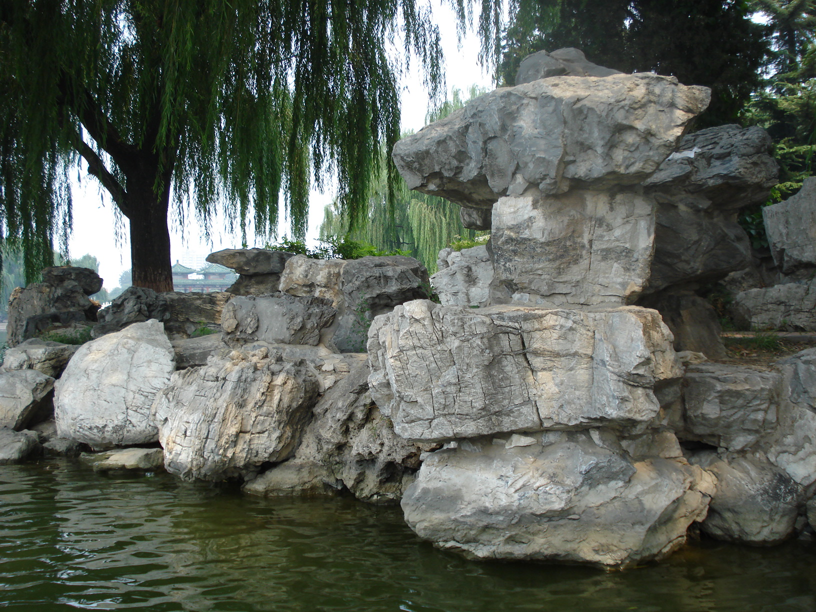 water with a small pond surrounded by rocks and boulders