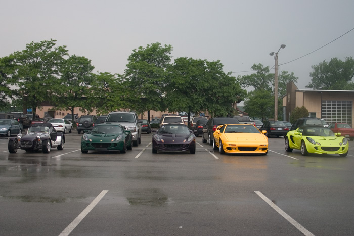 an outdoor parking lot with many cars parked in it
