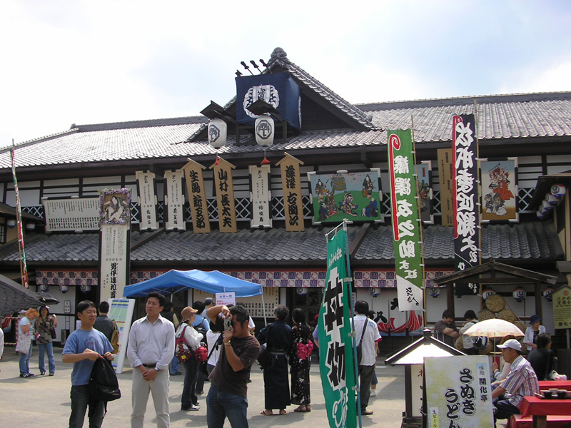 a group of people gathered outside of a store