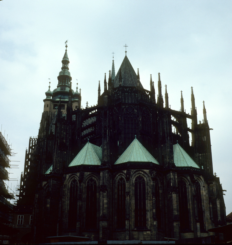 a large cathedral in a cloudy sky with a clock