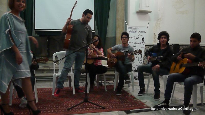 an acoustic group plays music in a school hall