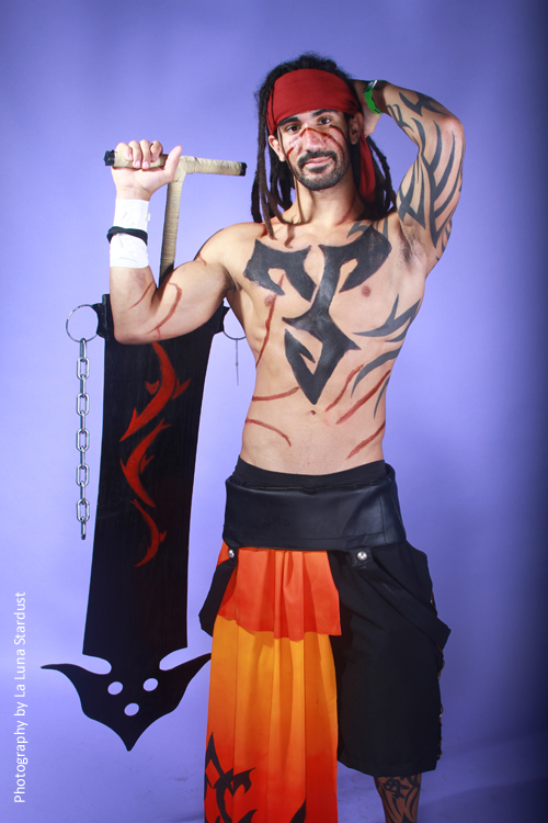 a tattooed man posing holding two swords